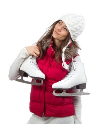Young woman holding ice skates for winter ice skating sport activity in white hat smiling isolated on a white background