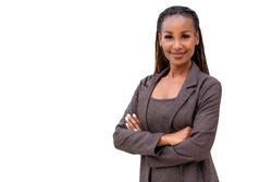 Beautiful female african american business woman CEO in a suit, isolated on white background, standing confidently with arms folded