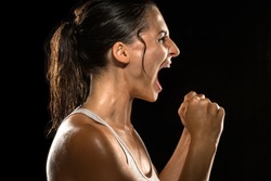 Victorious scream shout celebration intense woman athlete victory winning female champion