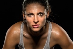 Serious confident stare champion athlete wrestler exercise trainer conviction focused powerful modern female