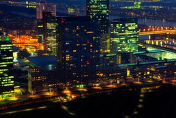 Vienna Modern District in the Night . Aerial View of Illuminated Capital City in the Nighttime . Skyscrapers with illumination