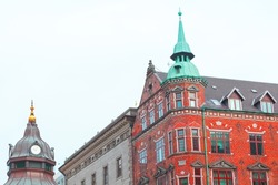 Danish architecture with spire . Red bricks building in Scandinavia 