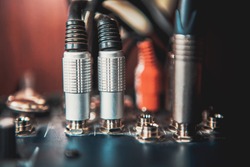 closeup image of audio Jacks on sound mixer console
