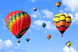 colorful hot air balloons over blue sky