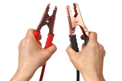 Hands with jumper cables isolated on white background