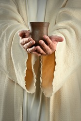 Hands of Jesus holding cup of wine