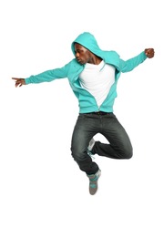 Portrait of African American hip hop dancer jumping isolated over white background