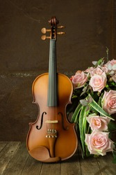 Vintage violin with old steel background