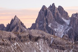 Mountain peaks in alpenglow in dolomites