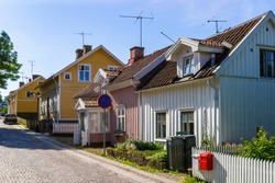 City street with old beautiful small wooden houses