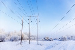 Power line in a wintry landscape