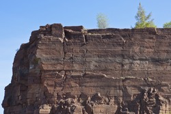 Rock wall of the old slate open pit