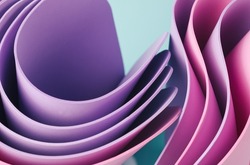 Dynamic motion abstract elements with pink and periwinkle sheets on a sunny teal background. Elegant flow background