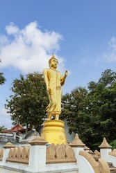 The iconic standing Buddha in Wat Phra That Khao Noi, one of the most tourist attraction destination places in Nan province, Northern of Thailand