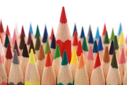 Business concepts: red crayon standing out from the crowd