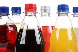 Bottles with soft drinks, isolated on a white background