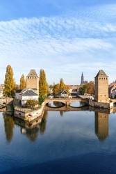 La Petite France with bridge over river Ill water tower portrait format copyspace copy space Alsace in Strasbourg, France city
