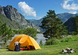 The Camping Tent near mountain river in the summer