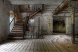 Old staircase in an abandoned factory and tracks