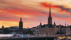 Stockholm, Sweden. Scenic View Of Stockholm Skyline At Summer Evening. Famous Popular Destination Scenic Place In Sunset Lights. Riddarholm Church, Subway Railway. Day To Night Transition Time Lapse.