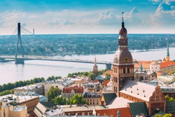 Riga, Latvia. Riga Cityscape In Sunny Summer Day. Famous Landmark - Riga Dome Cathedral