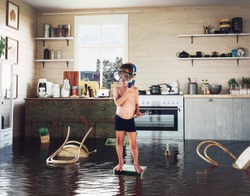 kids play on the table while flooding in the kitchen. Photo and media photocombination