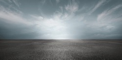 Sky Background Horizon with Dramatic Clouds and Empty Dark Asphalt Street Floor