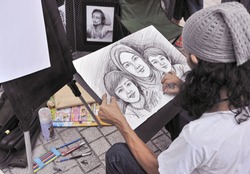 A street painter sketching a family portrait