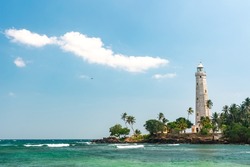 Beautiful beach and White lighthouse Dondra in Sri Lanka.