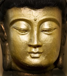 golden buddha face statue