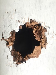 A hole on the wooden board