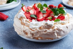 Cake Pavlova with meringue, strawberry and cream, selective focus image