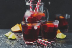 Spanish sangria with orange and lime, selective focus and toned image