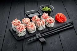 Sushi roll Snow crab, with crab meat. Sushi roll with rice, cream cheese, avocado, salmon. California. Sushi menu. Japanese kitchen, restaurant.