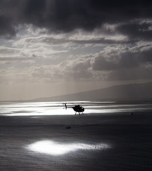 Helicopter hovers over Hawaii coast 