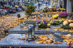 Decorated graves on Wolski Cemetery just before All Saints Day in Warsaw, capital of Poland