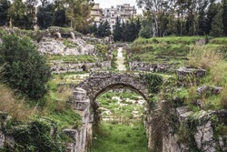 Roman Amphitheater in Neapolis archaeological park of Syracuse city, Sicily Island in Italy