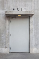 Exit door in concrete wall