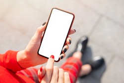 Woman using mobile phone, empty mockup screen for your own design
