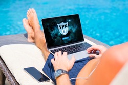 Man using VPN (Virtual Private Network) for secure and encrypted connection to internet.