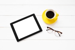 Tablet computer, coffee cup and glasses