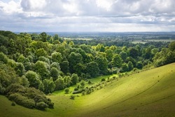UK countryside landscape. Green rolling hills with trees and meadow. View from Chiltern Hills toward Aylesbury Vale. Buckinghamshire, UK