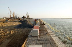 Construction site in port maritime. Extension of a dock