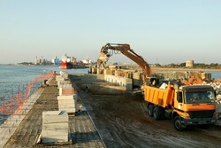 Construction site in port maritime. Extension of a dock