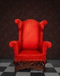   Red old armchair in a vintage room