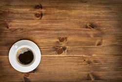 Coffee cup top view on wooden table background
