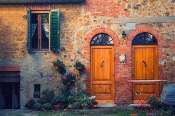 old brick italian facade stylized vintage hipster with two doors and a window