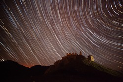 startrails over abandonded castle - starry night in August