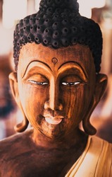 carved wooden buddha face buddhism