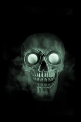 Glowing and smoking halloween skull